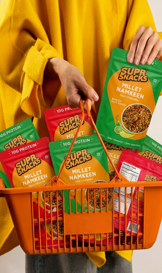 Person holding a basket of Super Snacks brand snacks in various flavors.
